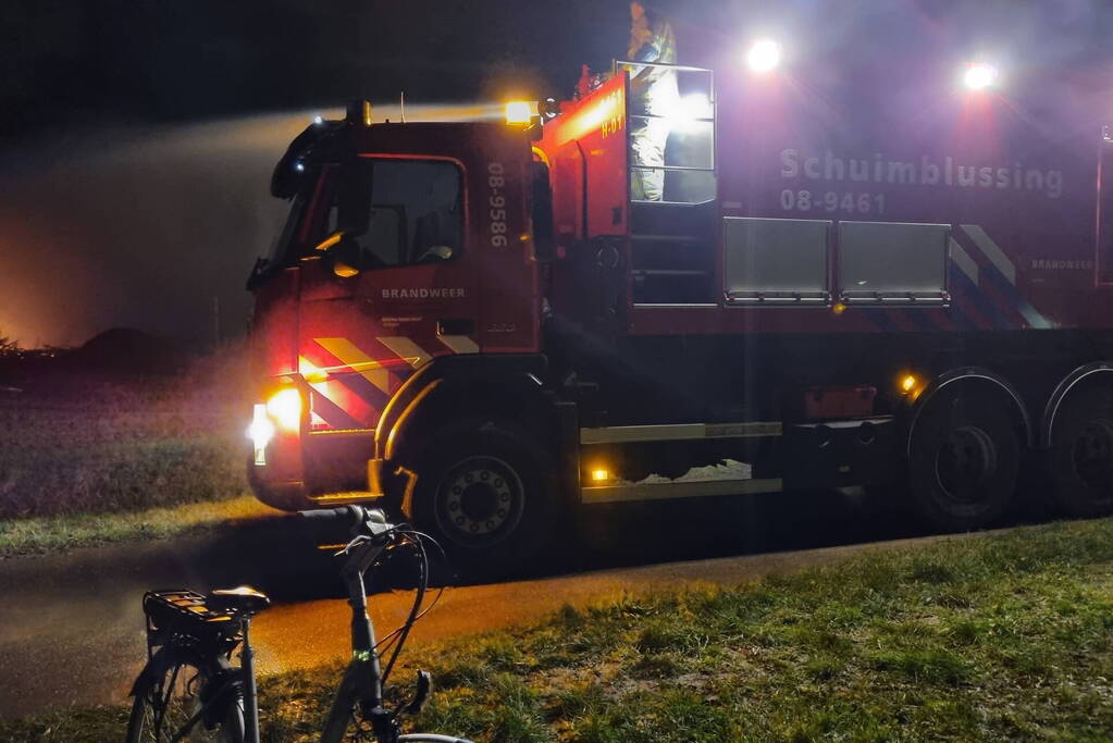 Stapel hout in brand