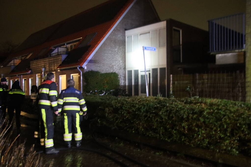 Brand in portiek woning