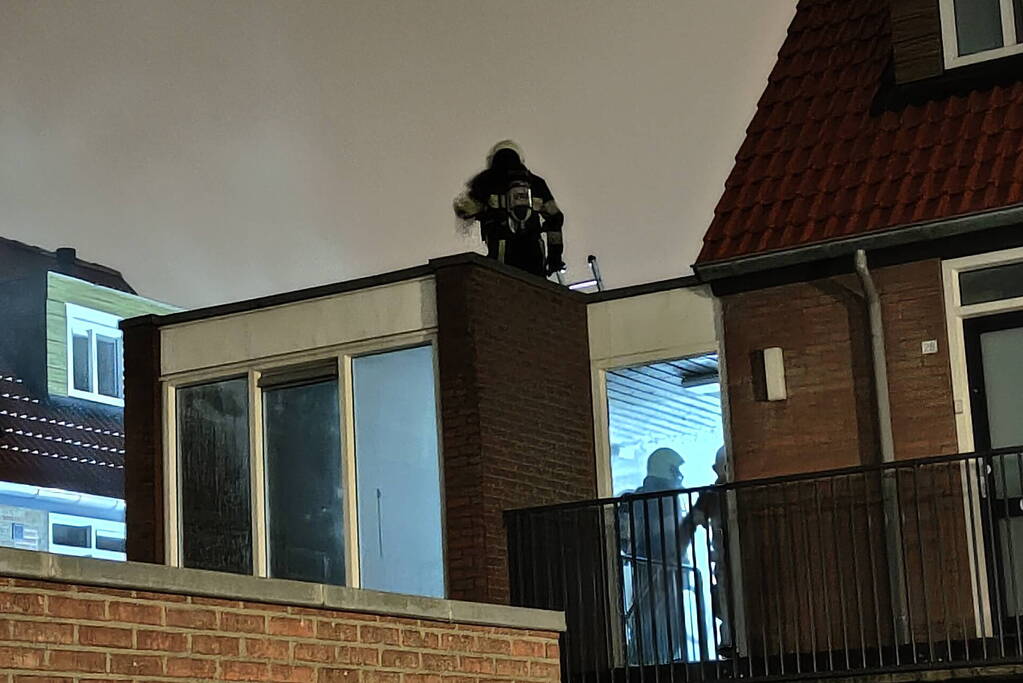 Brand in portiek woning