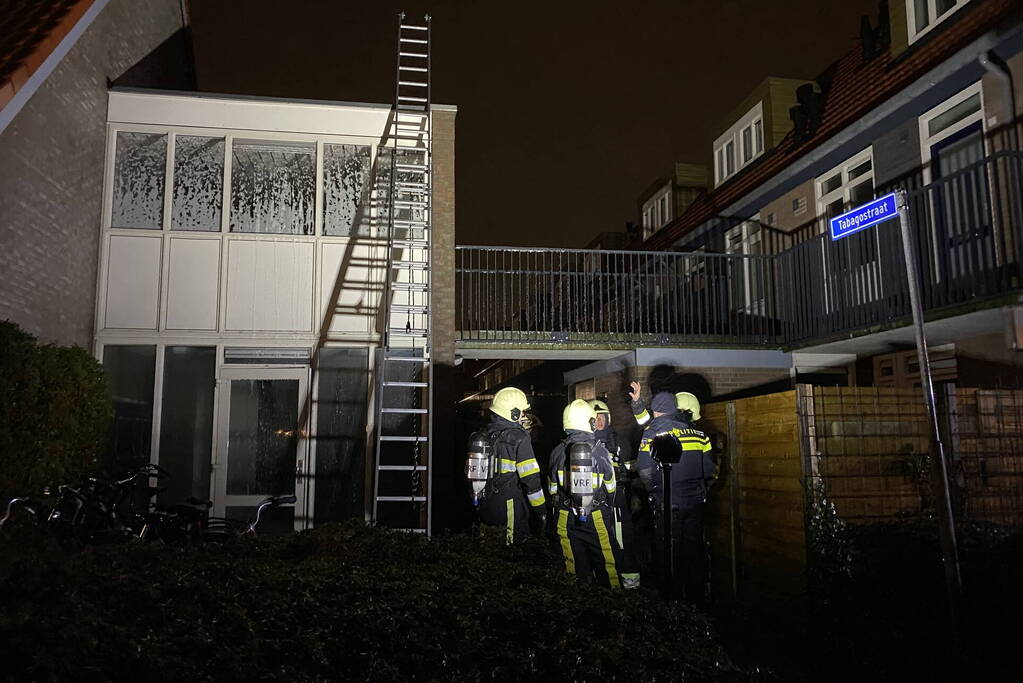 Brand in portiek woning