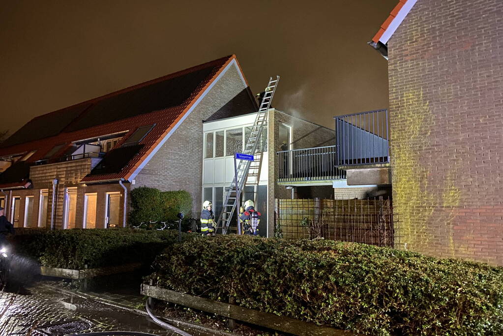 Brand in portiek woning