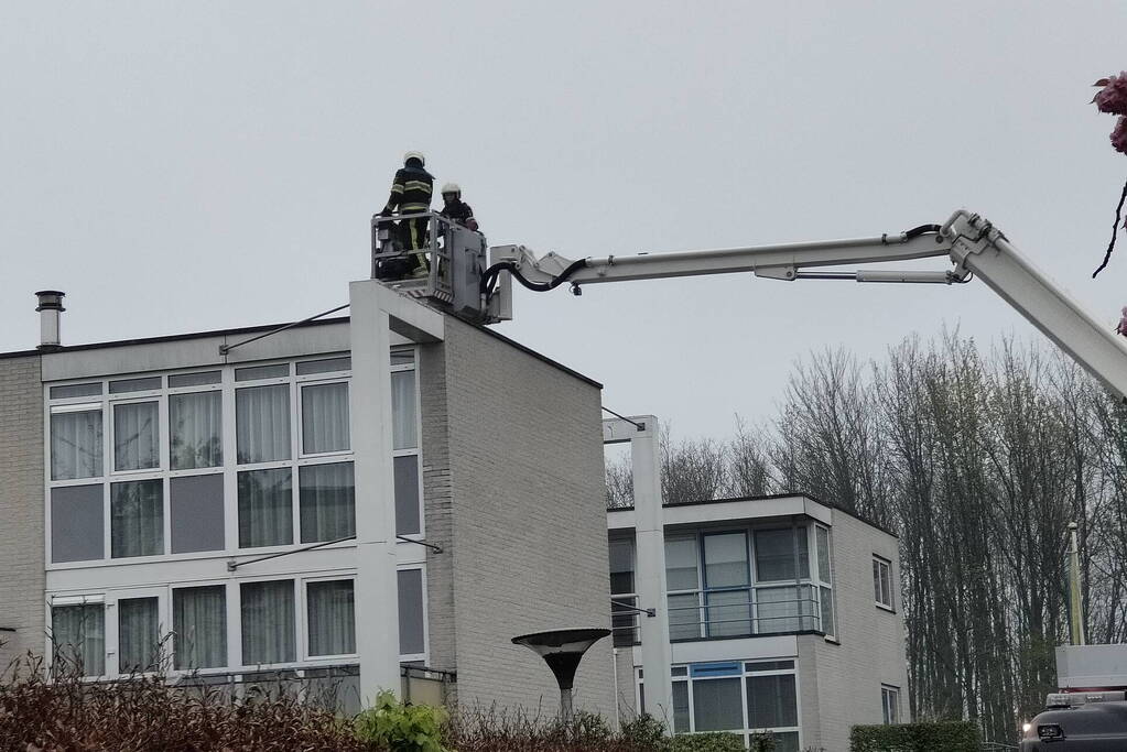 Schoorsteen geveegd na brand