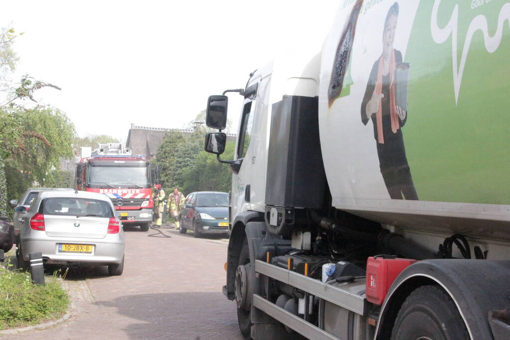 Laadruimte vuilniswagen vat vlam