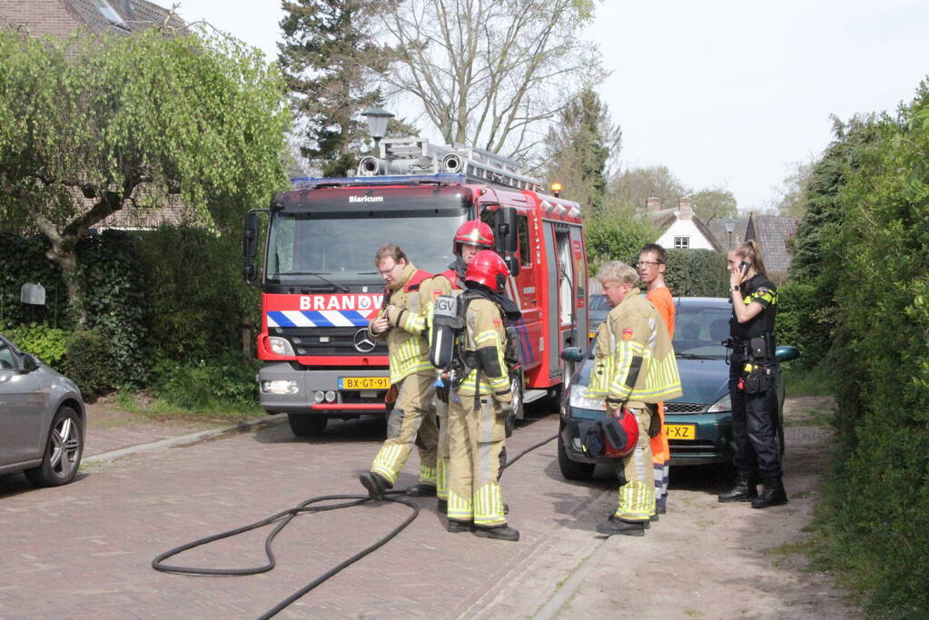 Laadruimte vuilniswagen vat vlam