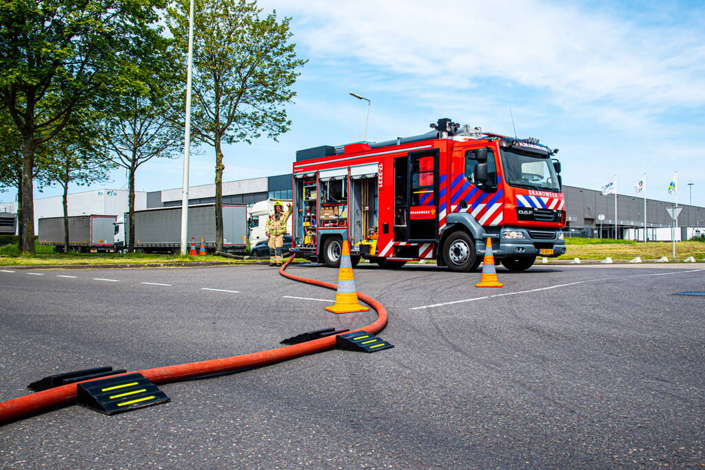 Brand in perscontainer met papier