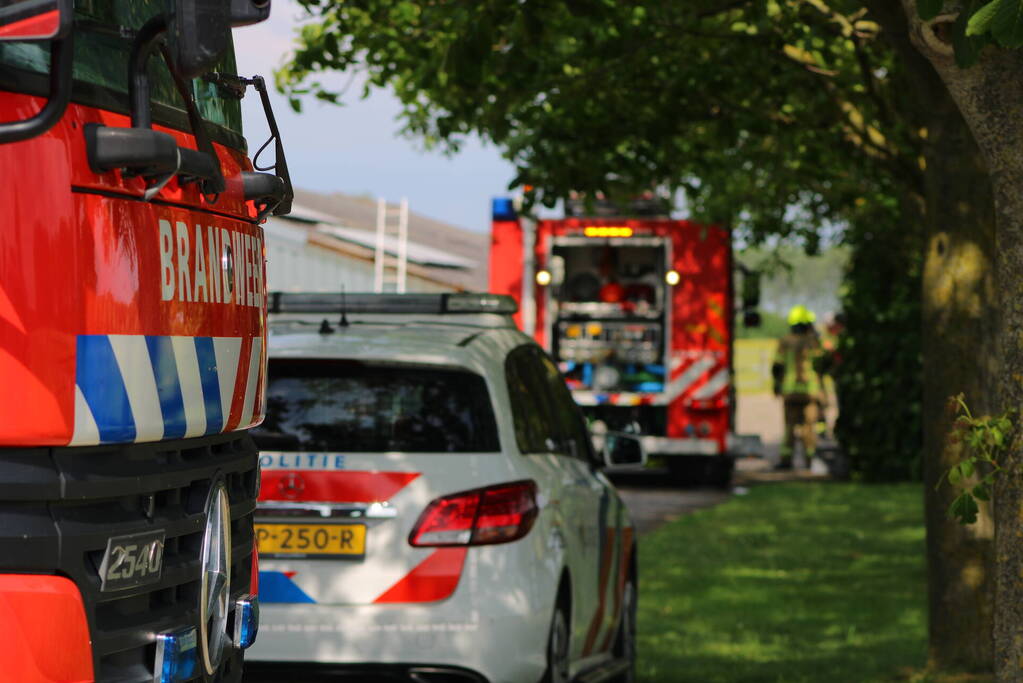 Brand in muur van schuur