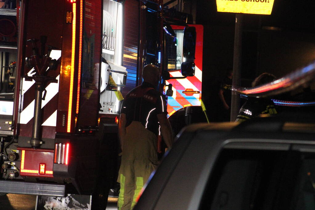 Rookontwikkeling uit woning, persoon naar ziekenhuis