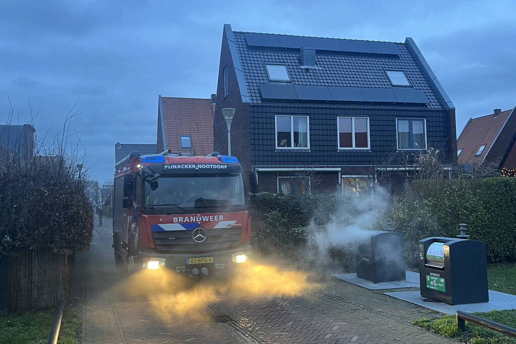 Ondergrondse container in brand