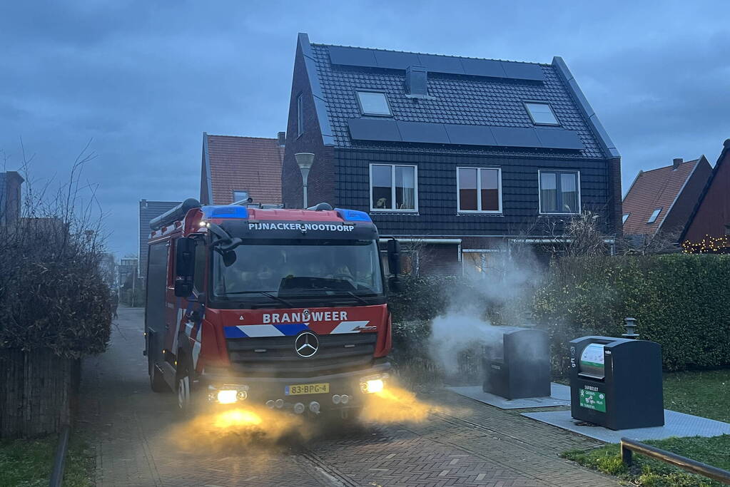 Ondergrondse container in brand
