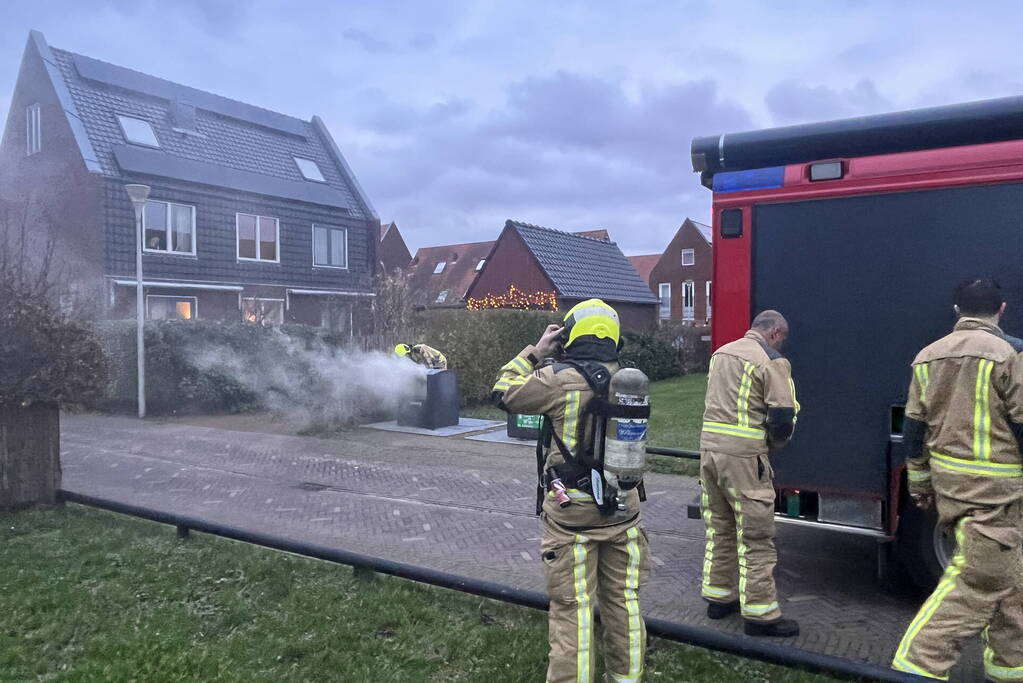 Ondergrondse container in brand