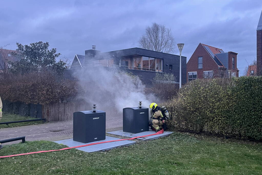 Ondergrondse container in brand