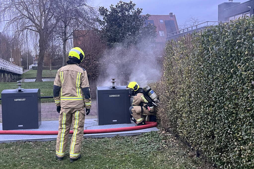 Ondergrondse container in brand