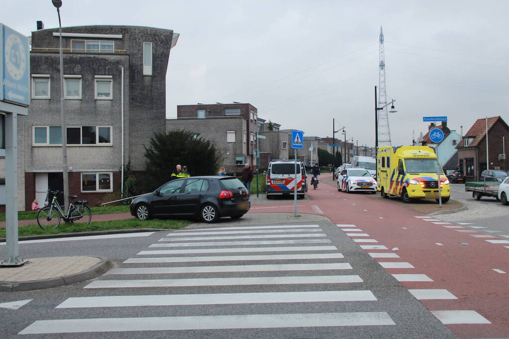 Fietser en automobilist in botsing