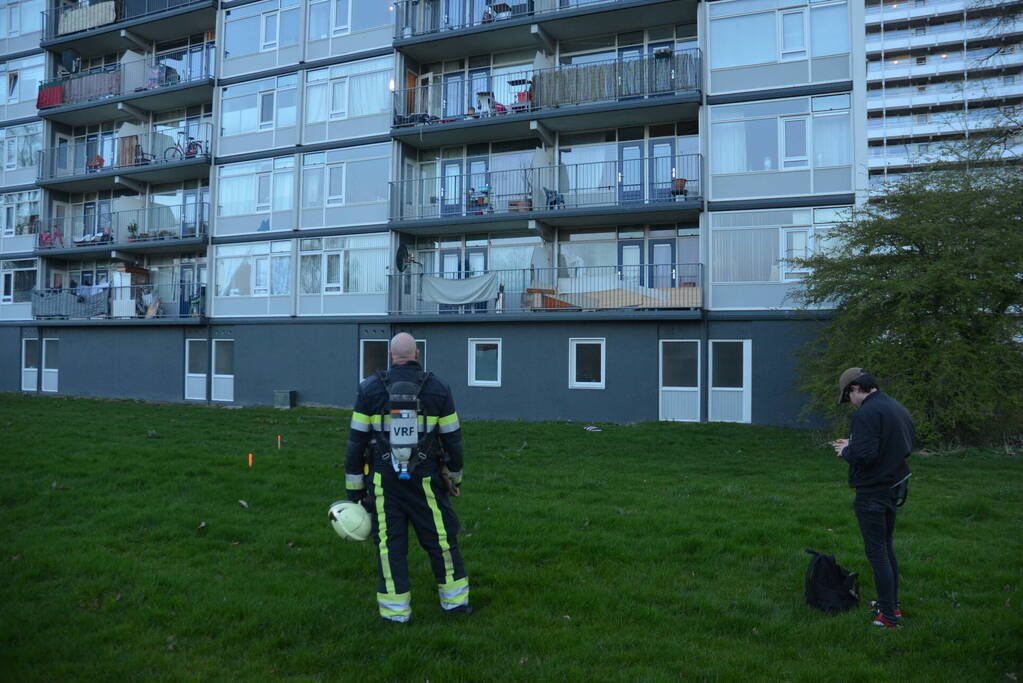 Rookoverlast door barbecue op balkon