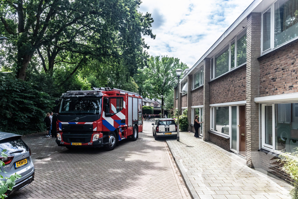 Brandweer blust brandende oven