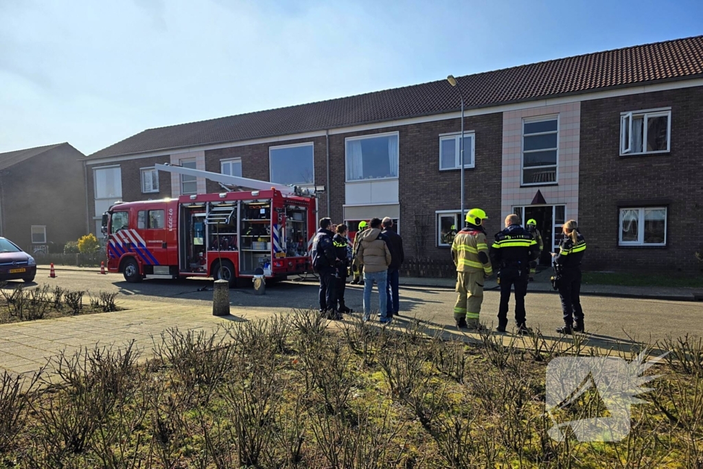 Melding van brand in portiekwoning