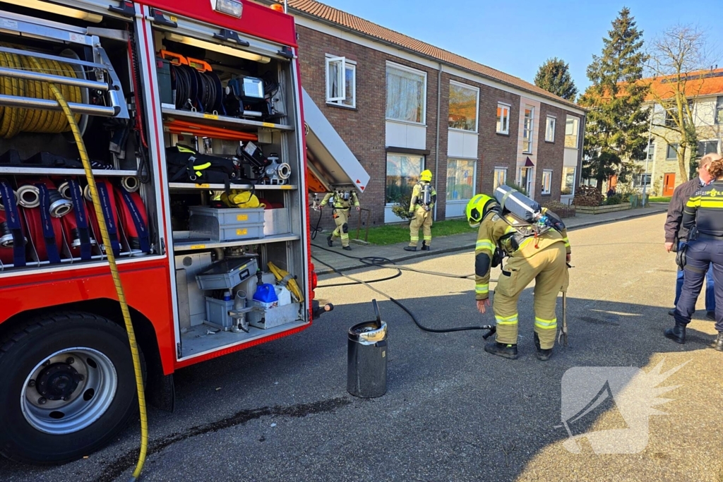 Melding van brand in portiekwoning