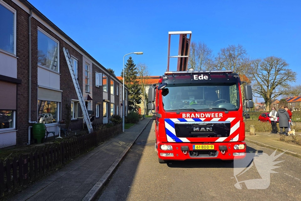 Melding van brand in portiekwoning