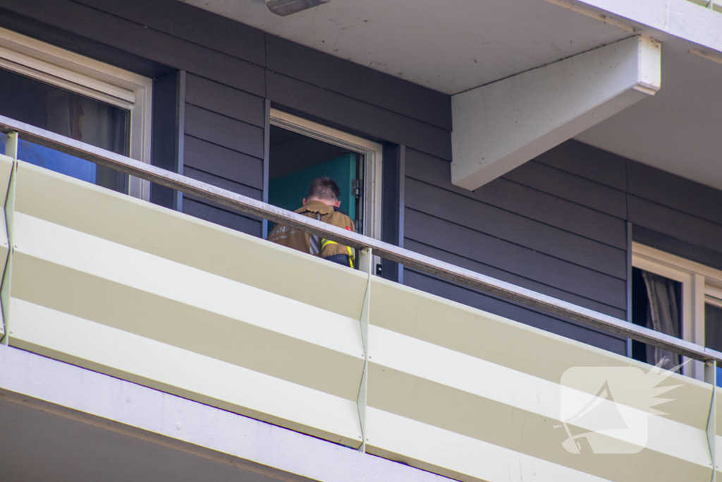 Brand in flatwoning snel onder controle