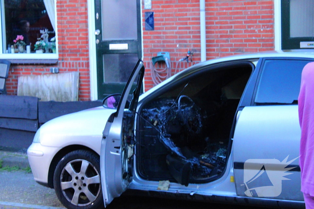 Binnenkant auto zwart door brand