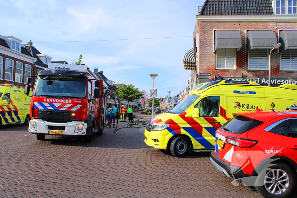Veel rookontwikkeling bij brand in appartementen boven winkels