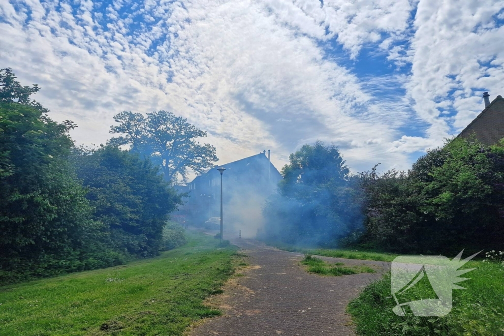 Schade aan poort en schutting door brand