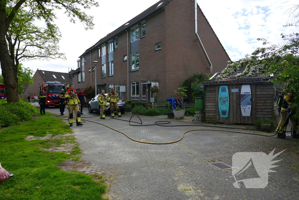Schade aan poort en schutting door brand