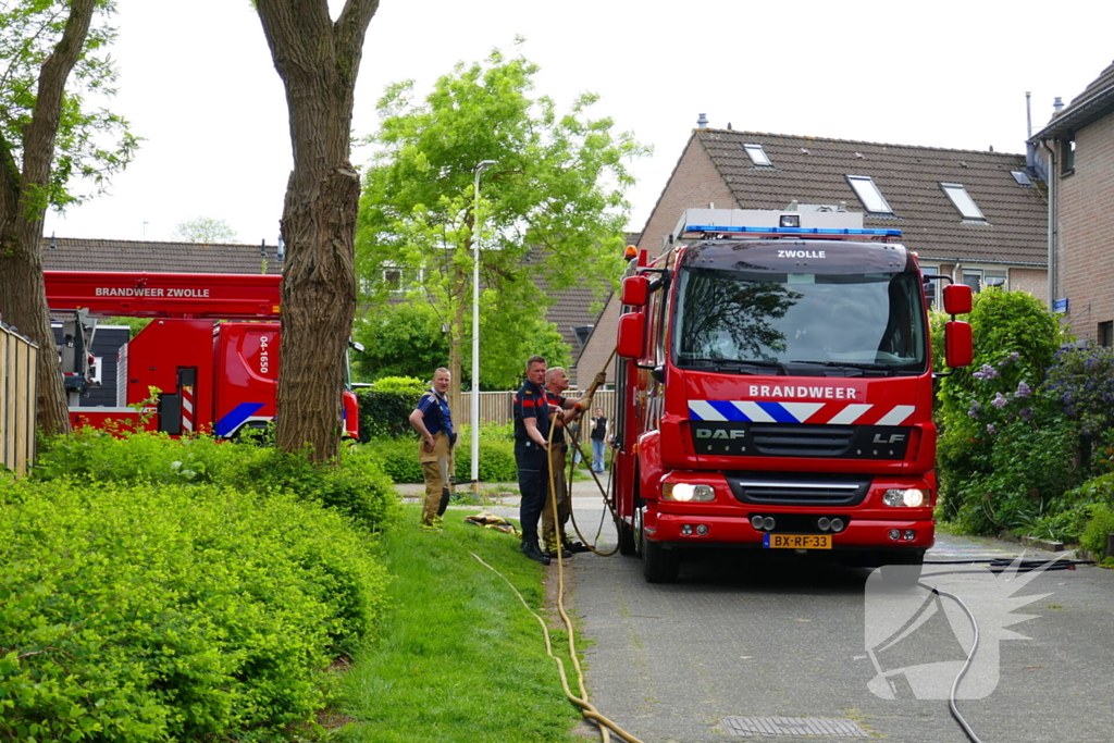 Schade aan poort en schutting door brand