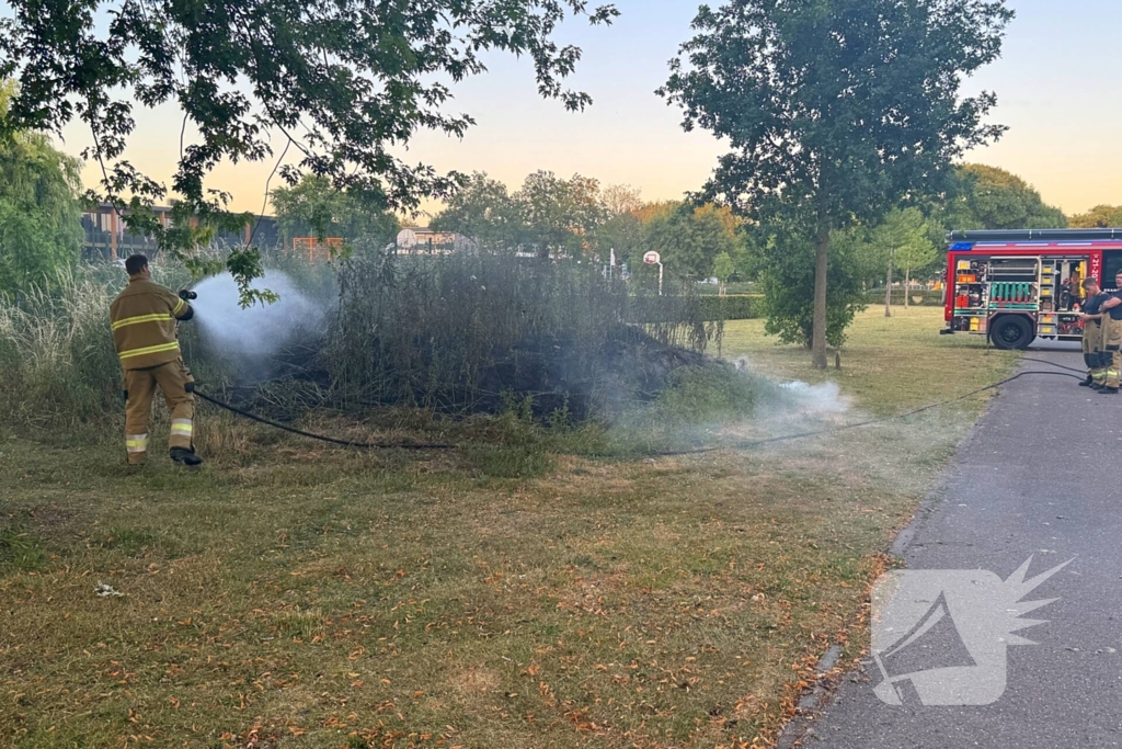 Brandweer blust bermbrand