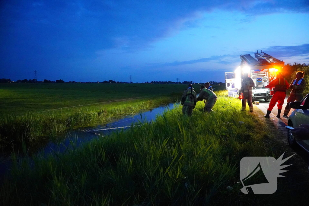 Reddingsactie door brandweer en boer