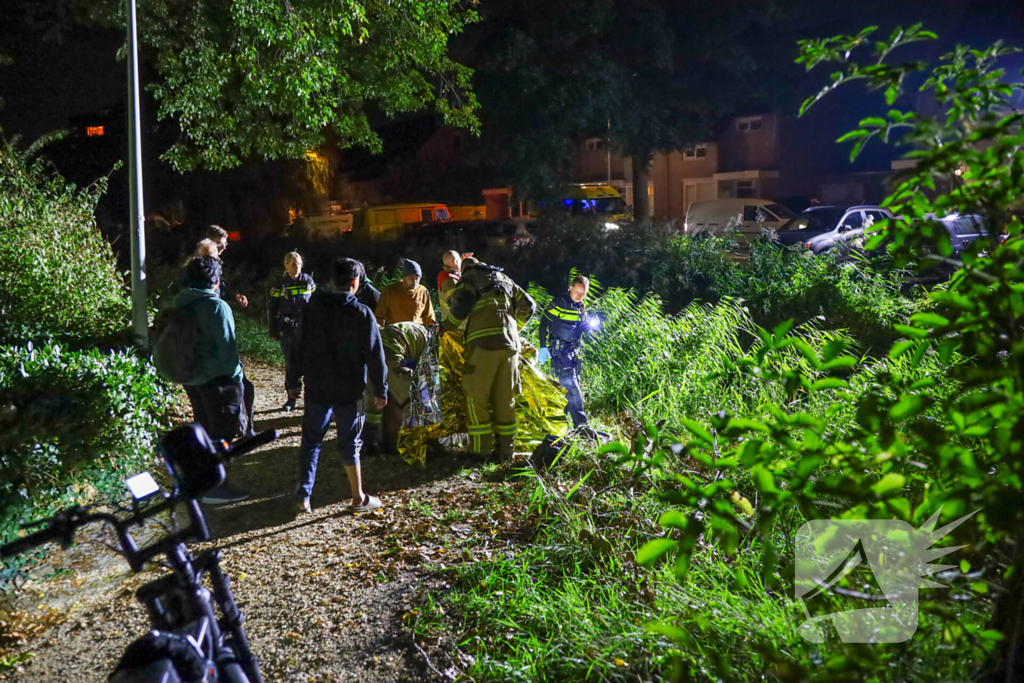 Scootmobiel bestuurder uit water gered