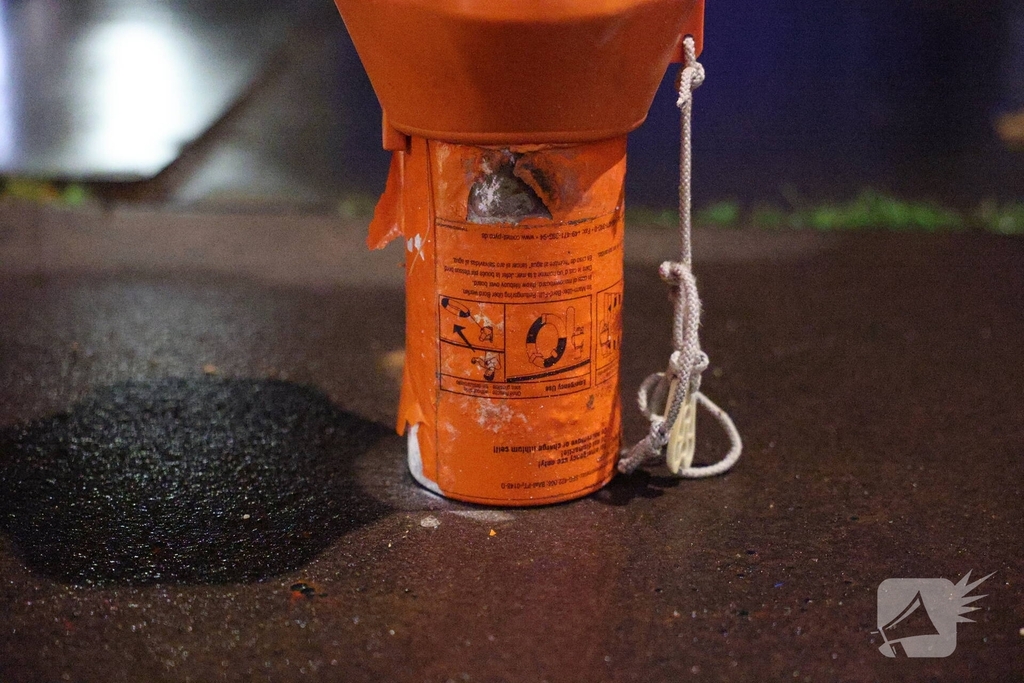 Woningbrand door noodsignaal met oranje rook