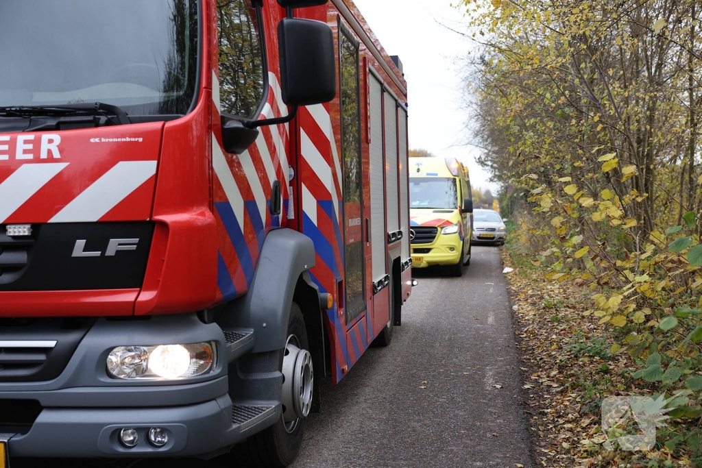 Man met scootmobiel te water