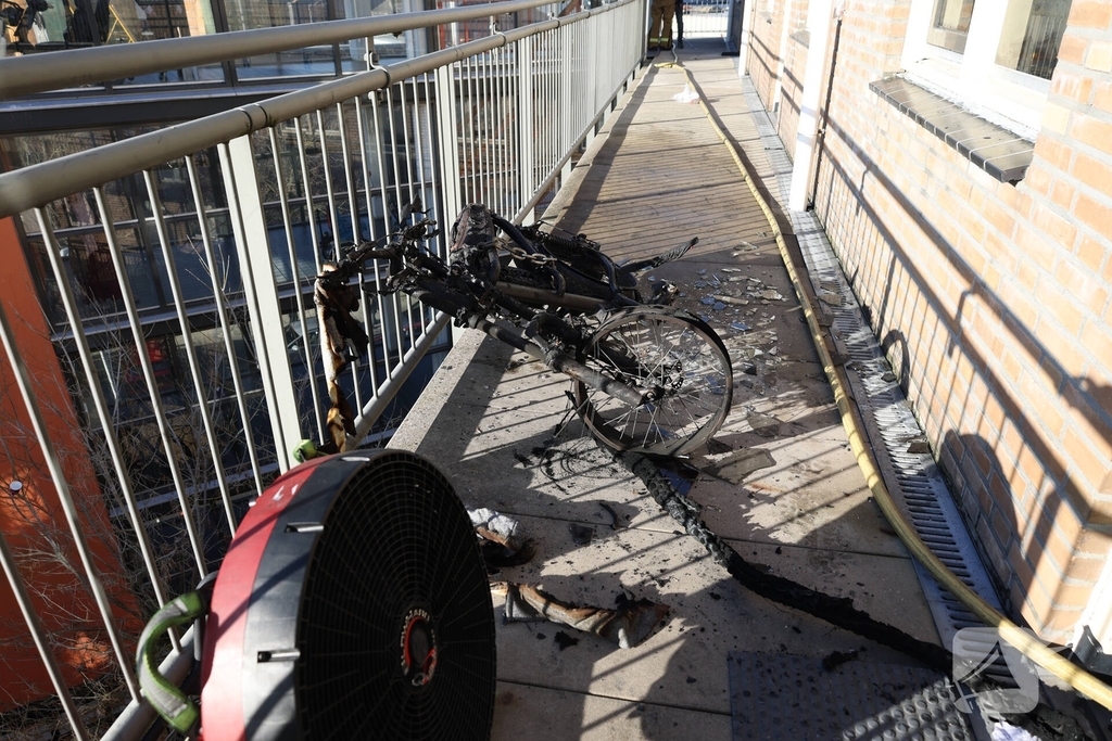 Politie pakt bewoner na woningbrand