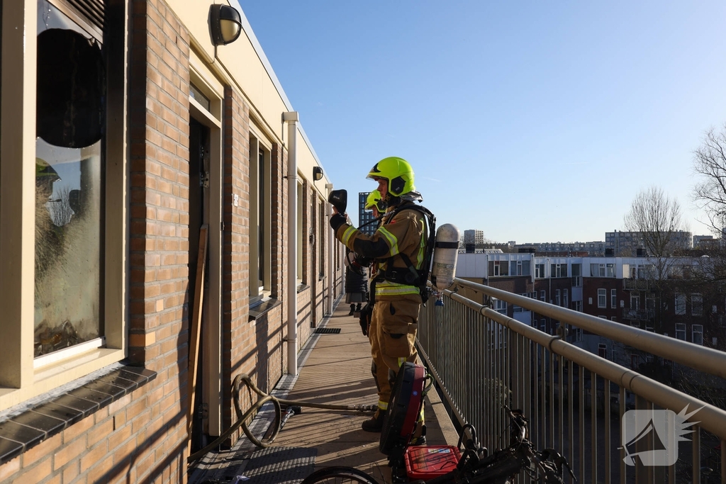 Politie pakt bewoner na woningbrand