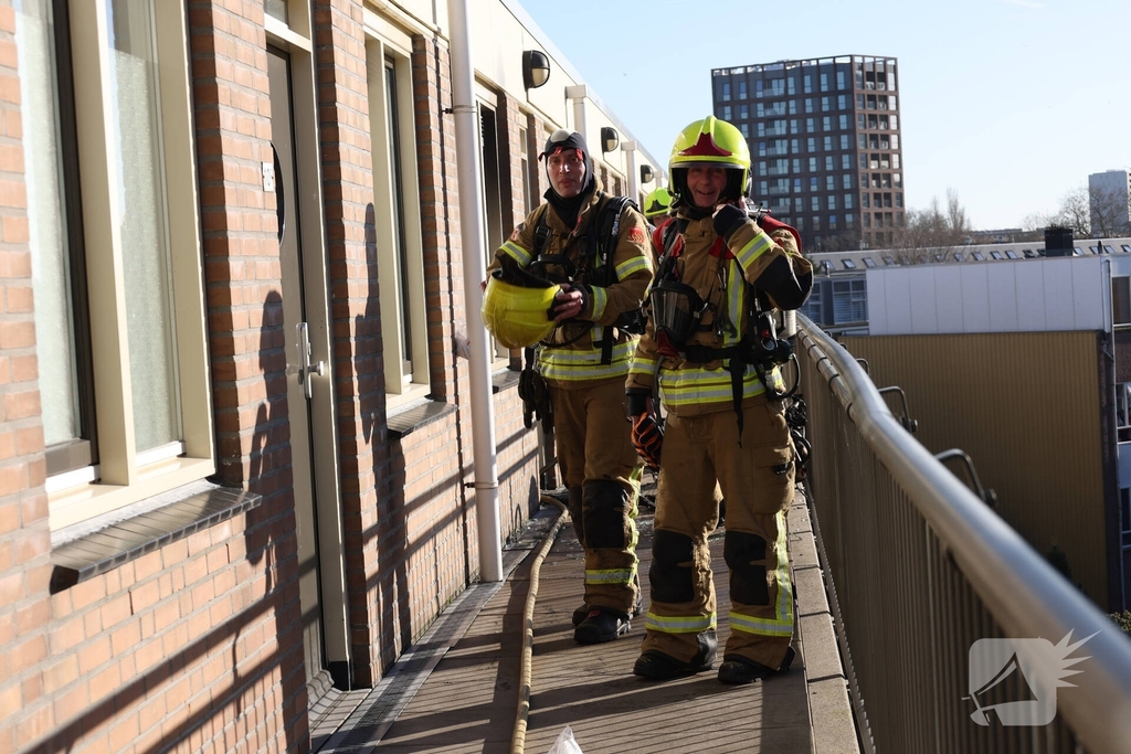 Politie pakt bewoner na woningbrand