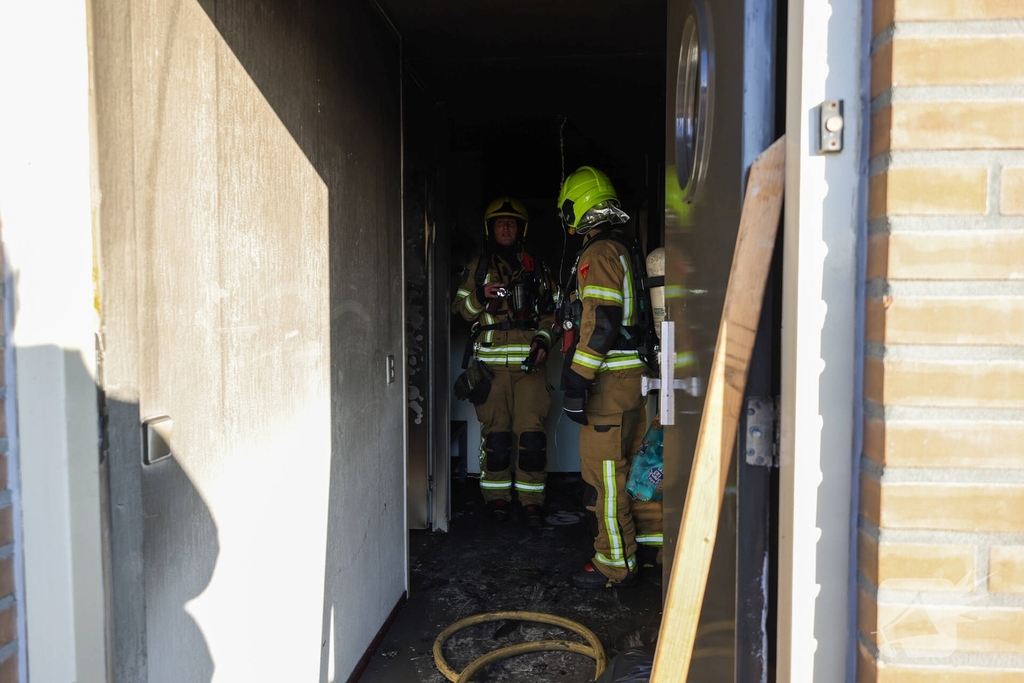 Politie pakt bewoner na woningbrand