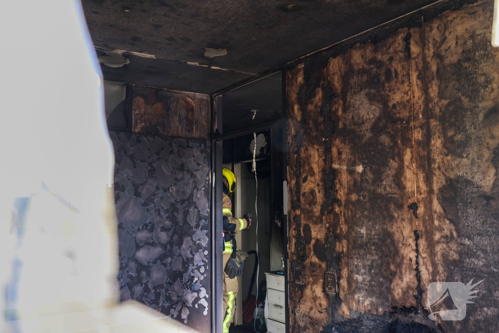 Politie pakt bewoner na woningbrand