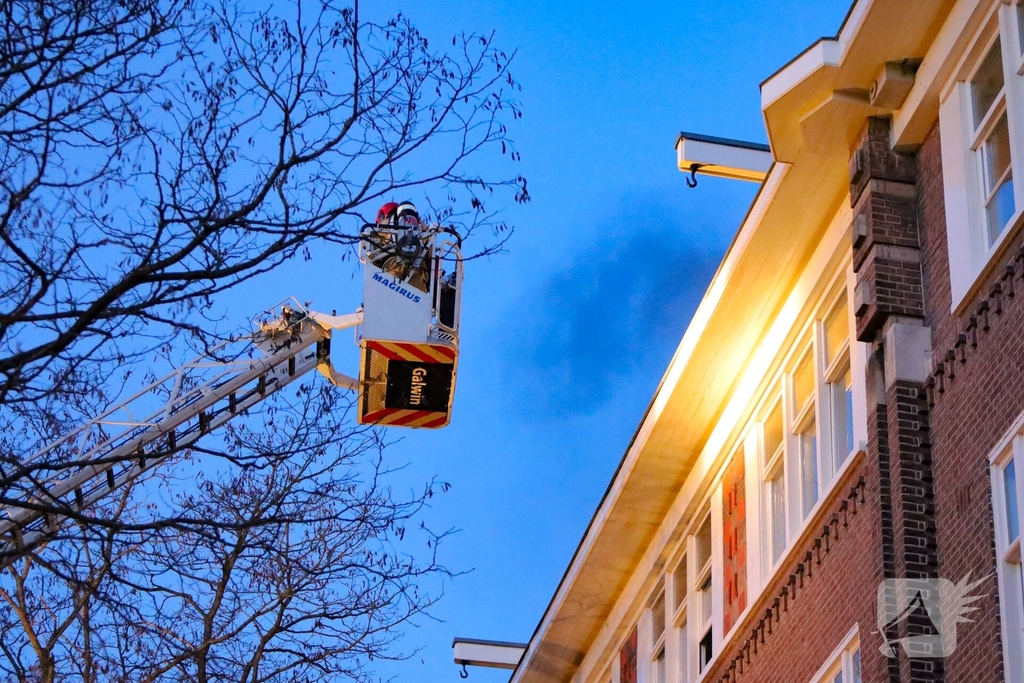 Brand in portiekwoning geblust