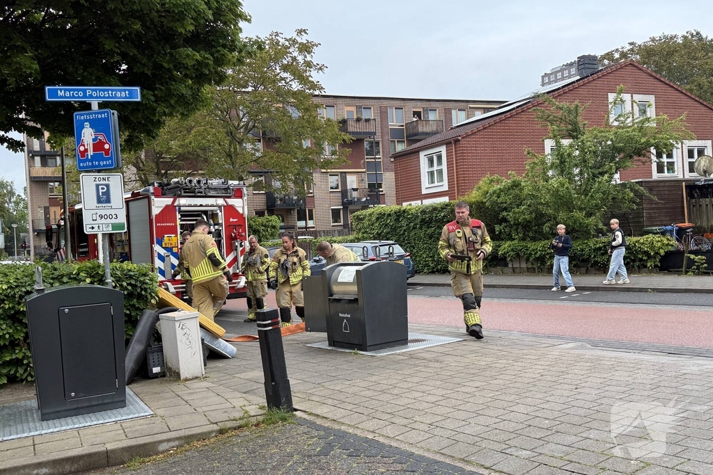 Ondergrondse container in brand