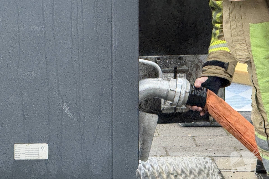 Ondergrondse container in brand