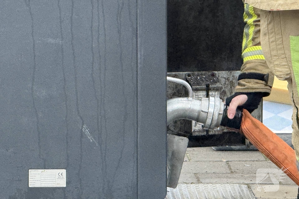 Ondergrondse container in brand