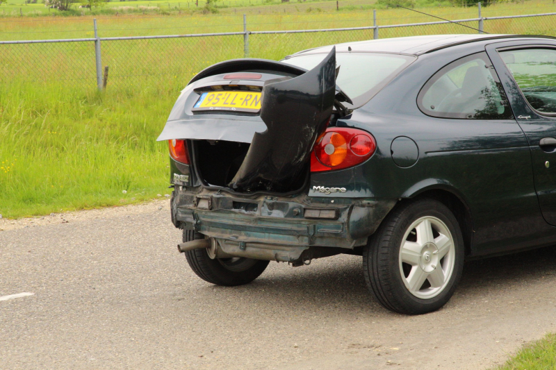 Schade bij botsing op rotonde