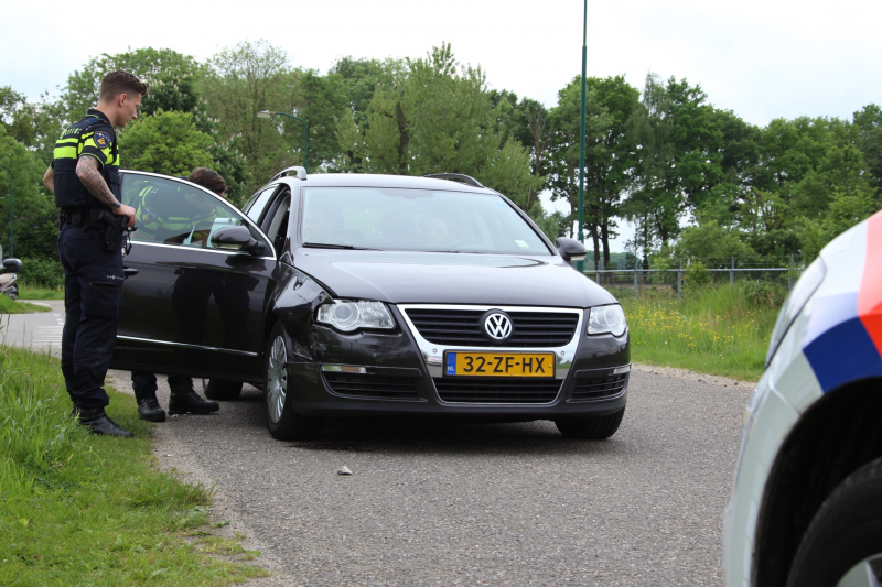 Schade bij botsing op rotonde