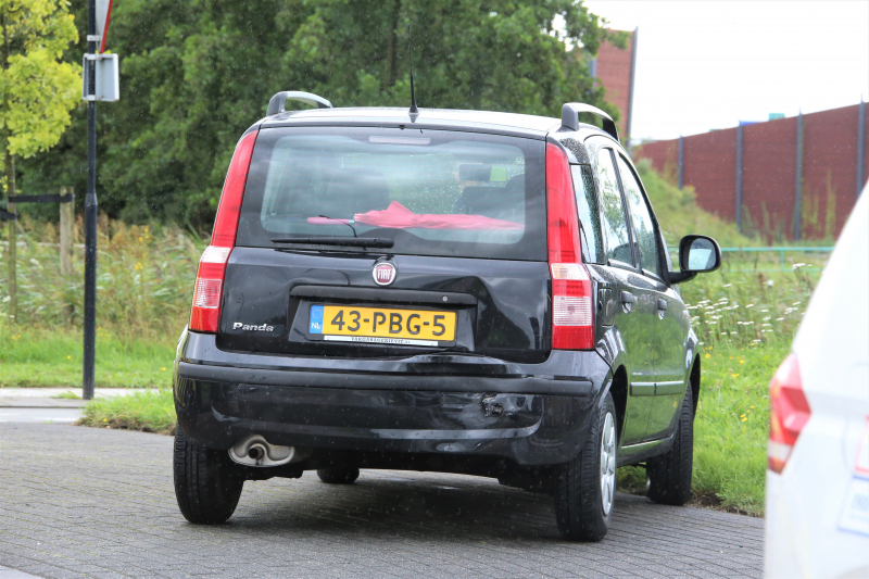 Kop-staartbotsing op rotonde