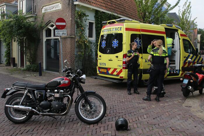 Scooterrijder gewond na botsing met motorrijder