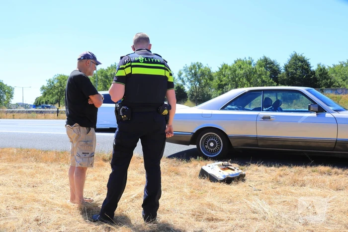 Achterbank auto vat vlam