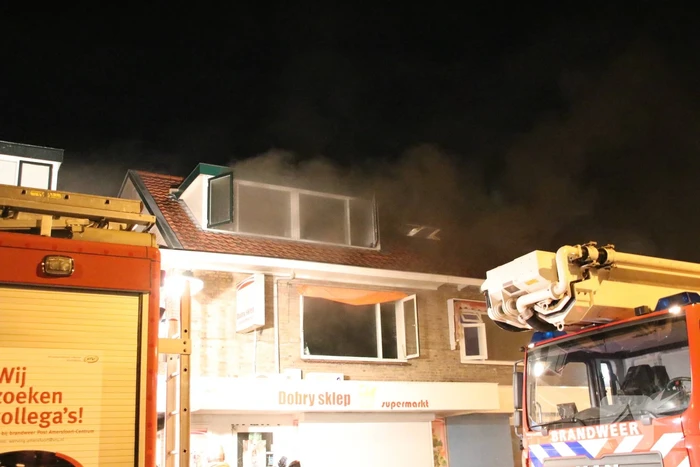 Grote schade en ravage bij winkelbrand