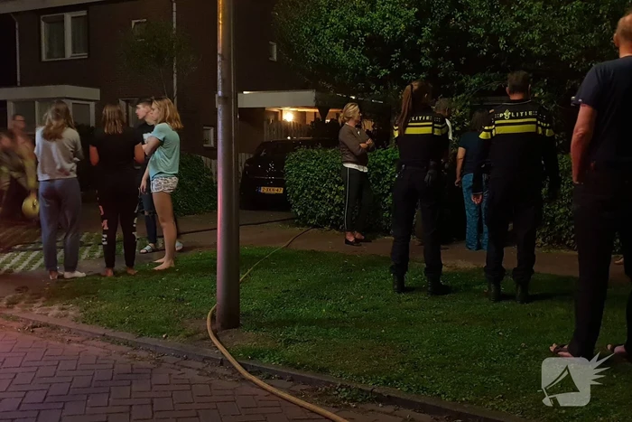 Aanbouw in brand woning vol rook