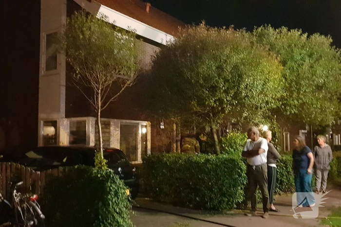 Aanbouw in brand woning vol rook